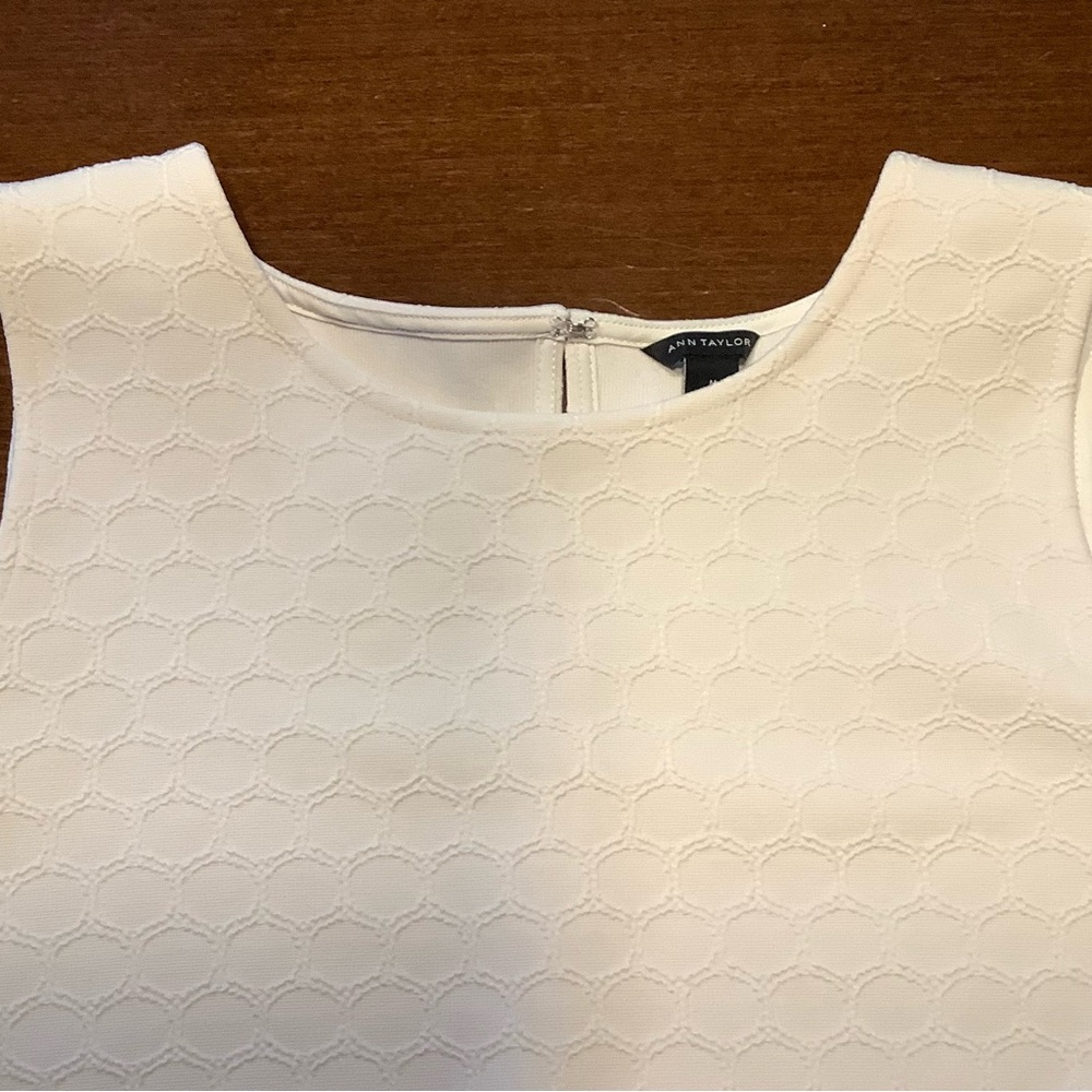Ann Taylor sleeveless white embossed top with flared hem, size M